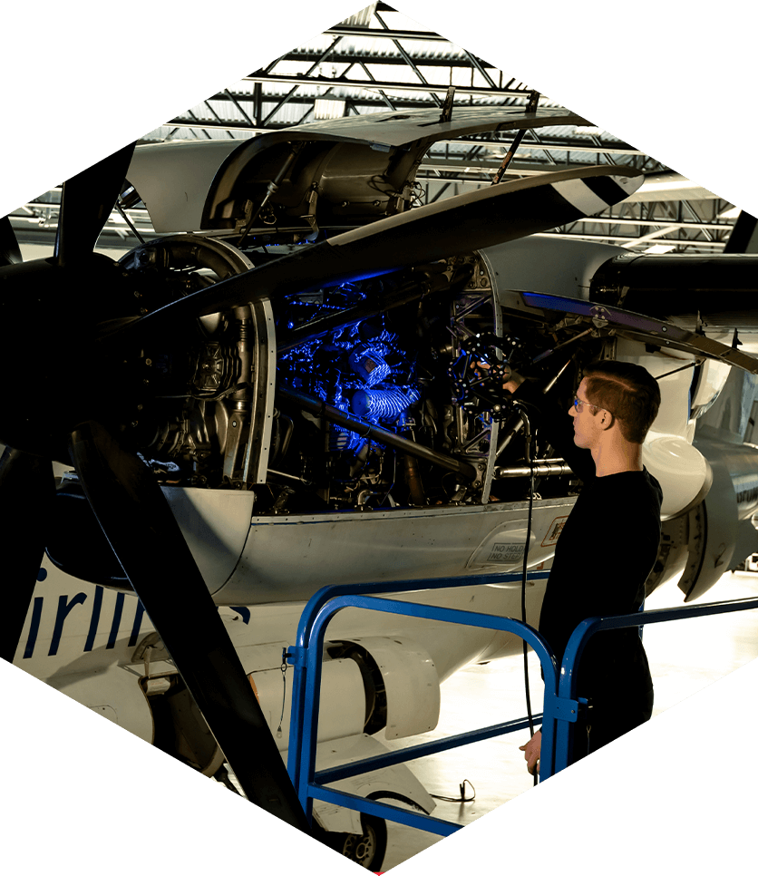 aerospace engineer scans engine